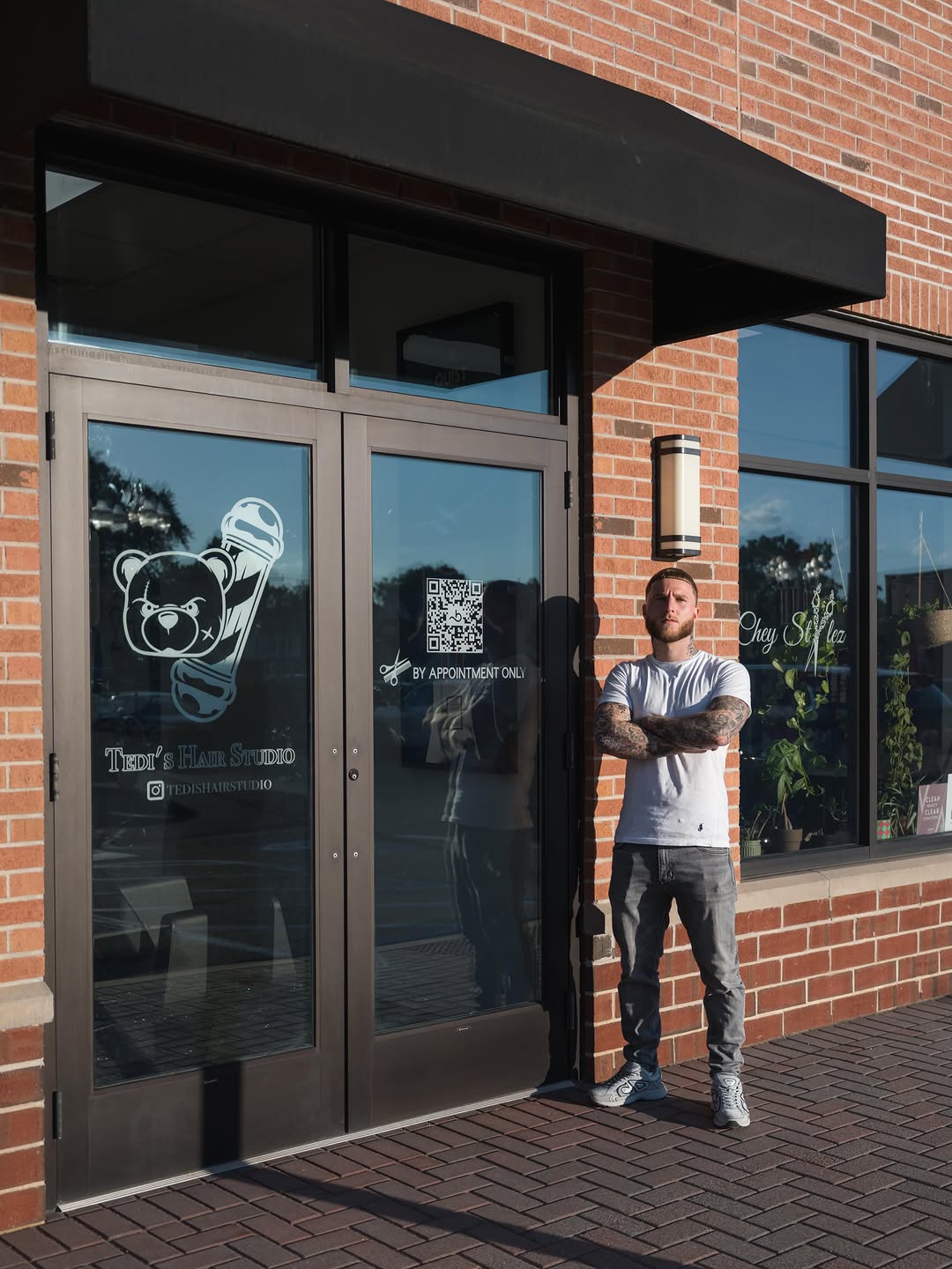 Tedi standing outside the studio at Bellazio Collective